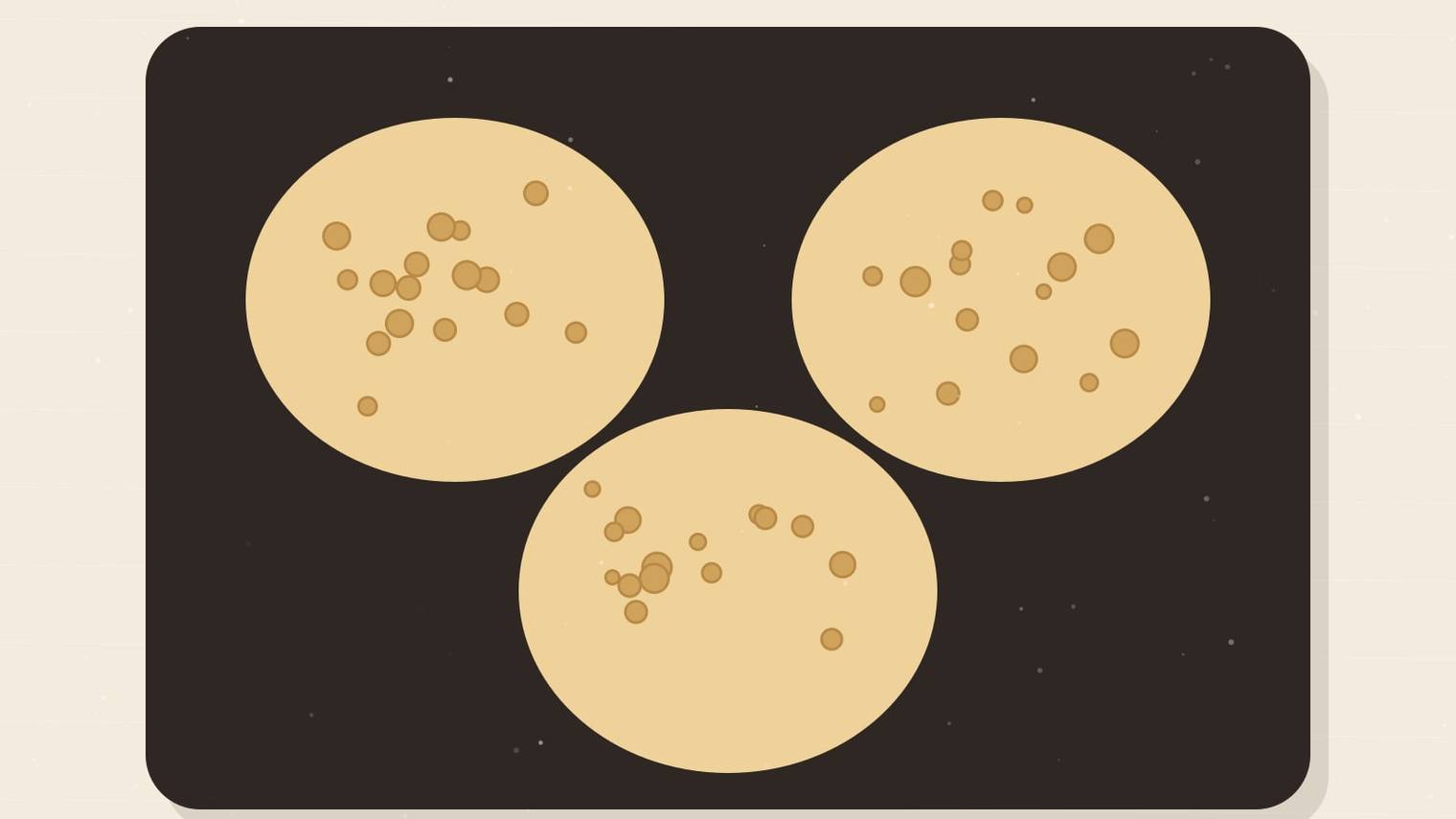 Illustrated griddle with three pancakes covered in small open bubbles