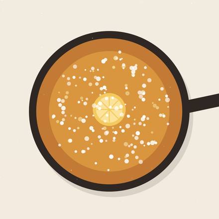 Illustrated cast-iron skillet holding a golden Dutch baby dusted with powdered sugar and a lemon slice