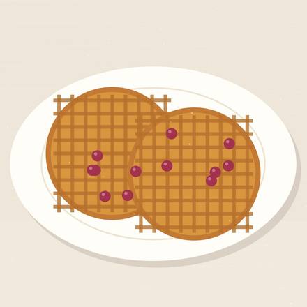 Illustrated pair of round golden waffles on a plate scattered with raspberries